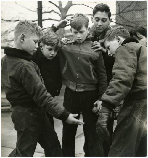 New York City boy playing ball with friends