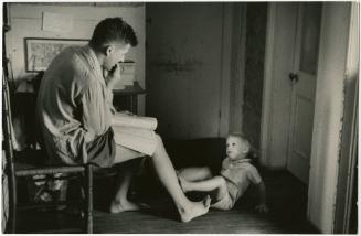 Father reading to young boy