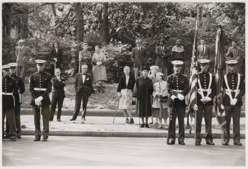 Uniformed marines standing at attention near sidewalk, U.S.A.