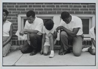 Cairo, Illinois from the series Memories of the Southern Civil Rights Movement 
SNCC field secretary, later SNCC Chairman, now Congressman John Lewis, and others pray during a demonstration.