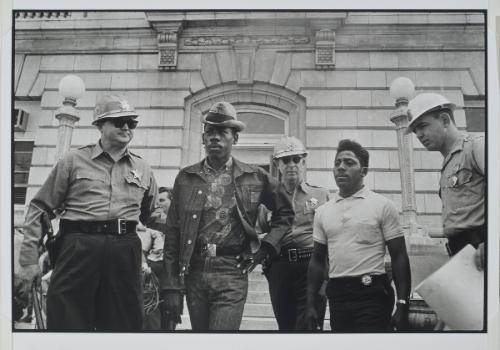 Selma, Alabama from the series Memories of the Southern Civil Rights Movement 
Sheriff Jim Clark arrests two young men demonstrating for voter registration on the steps of the federal building.