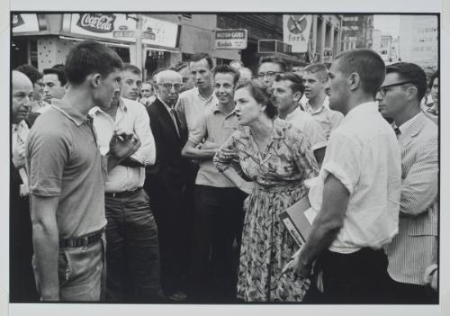 Atlanta, Georgia from the series Memories of the Southern Civil Rights Movement
An anonymous woman, who has come upon a mob abusing demonstrators with kicks, blows, and burning cigarettes. She holds the mob at bay and protects the demonstrators.