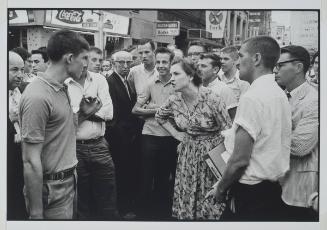 Atlanta, Georgia from the series Memories of the Southern Civil Rights Movement
An anonymous woman, who has come upon a mob abusing demonstrators with kicks, blows, and burning cigarettes. She holds the mob at bay and protects the demonstrators.