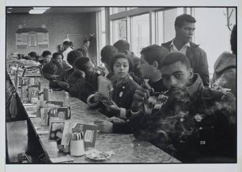 Atlanta, Georgia:  A Toddle House has the distinction of being occupied during a sit-in by some of America’s most effective organizers. In the room are Taylor Washington, Ivanhoe Donaldson, Joyce Ladner, John Lewis behind Judy Richardson, George Green, and Chico Neblett. from the series Memories of the Southern Civil Rights Movement