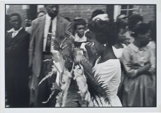 Birmingham, Alabama, additional photograph from the series Memories of the Southern Civil Rights Movement 
A friend of the murdered teenage girls enters the church for their funeral.