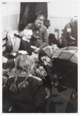 Woman listens to little girl, Warsaw, Poland