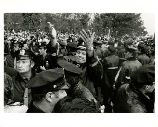 The police line breaks up after the passing of a foreign dignitary