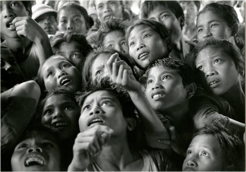 [Children Looking at Photographs Taken in their Village Ten Years Earlier, Bayung Gedé, Bali, Indonesia]