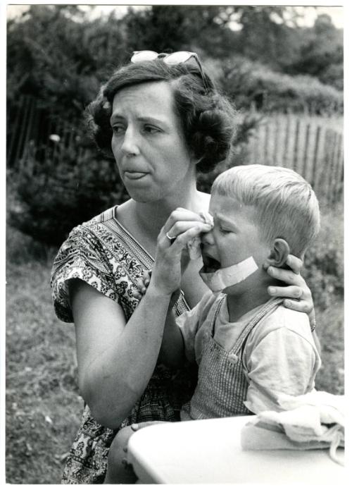 [Mother tending to injured son]