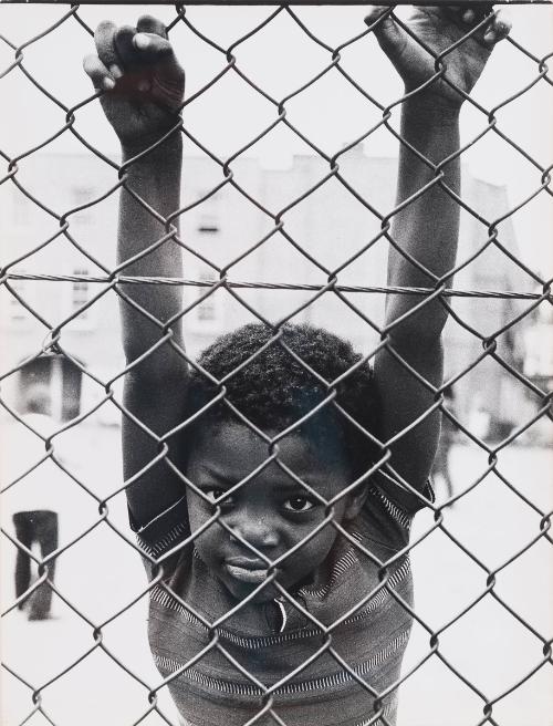 Child Hanging on Fence, Italy