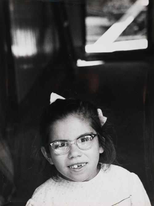 Girl with missing front tooth, Italy