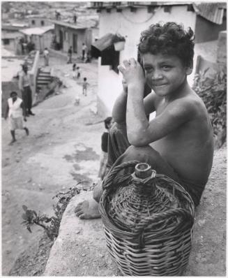 Boy with water jug, Venezuela