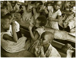 At a public primary school, young boys and girls have a rhythm exercise, Nigeria