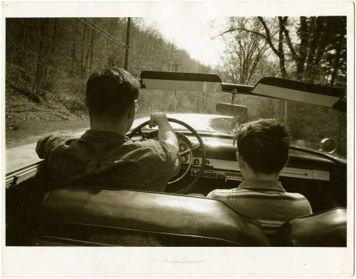 Father driving convertible with boy in glasses, from the series Big Brother