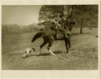 Boy with glasses on horse with riding instructor, from the series Big Brother