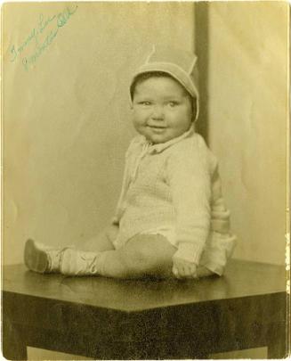 Jimmy Lee [Seated boy, striped background]