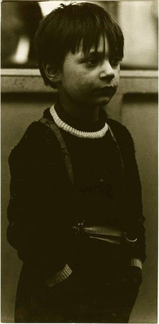 Boy in suspenders, Italy