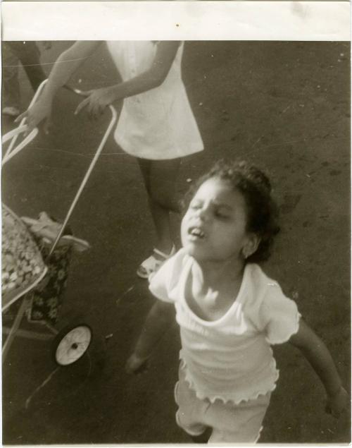 Walking girl with face turned upwards