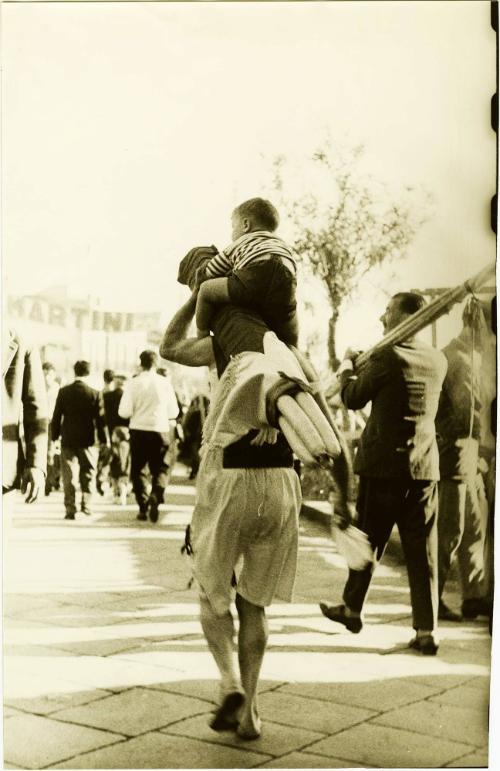 Father Carrying Son on His Back