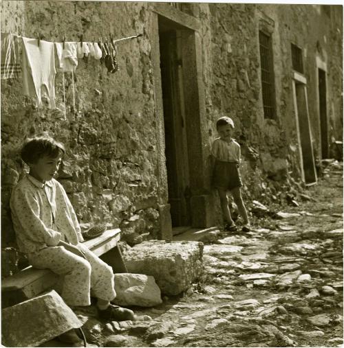 Child in Pajamas under Hanging Laundry