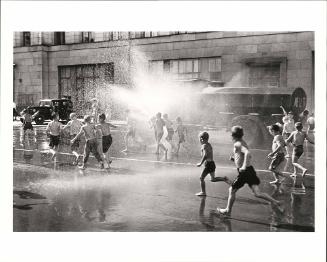 A hot summer's day: children at play in the fire hydrant