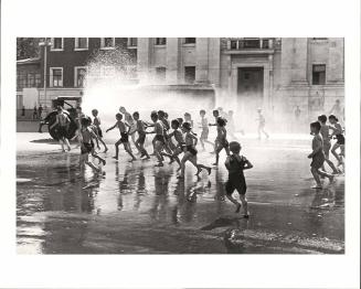 A hot summer's day: children at play in the fire hydrant