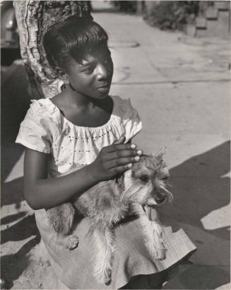 Seated girl with Staccato, New York City