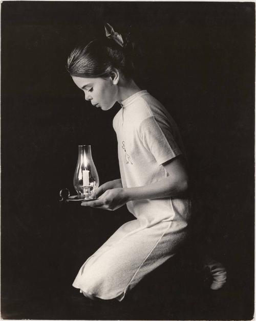 Portrait of girl holding candle