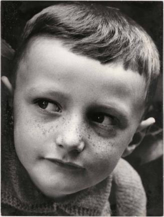 Close-up portrait of boy with freckles, Italy