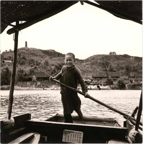 Ferryboat Boy, Earns his Living Poling Passegers across River near Chengtu, China