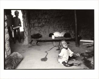 Screaming child on the floor, Ivory Coast, Africa