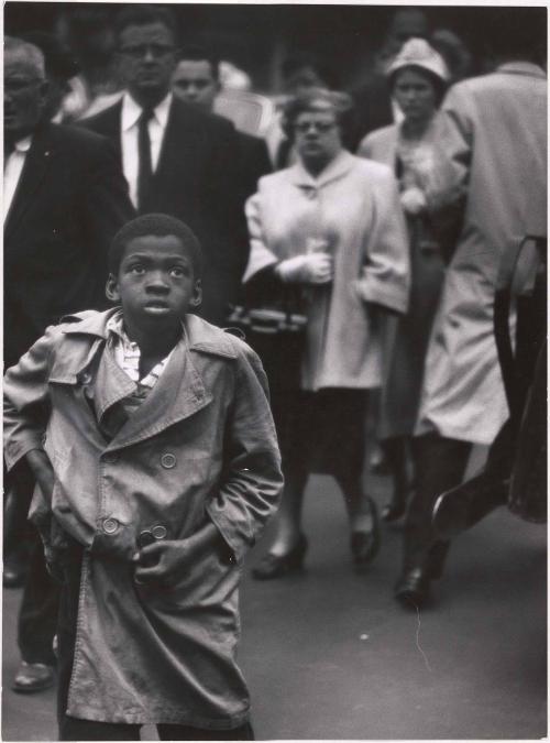 Boy in trench coat on a New York street