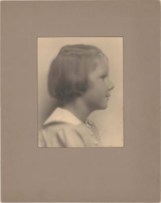 Portrait of girl in profile, short hair, close up