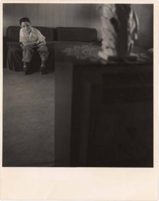 Boy watching television in living room