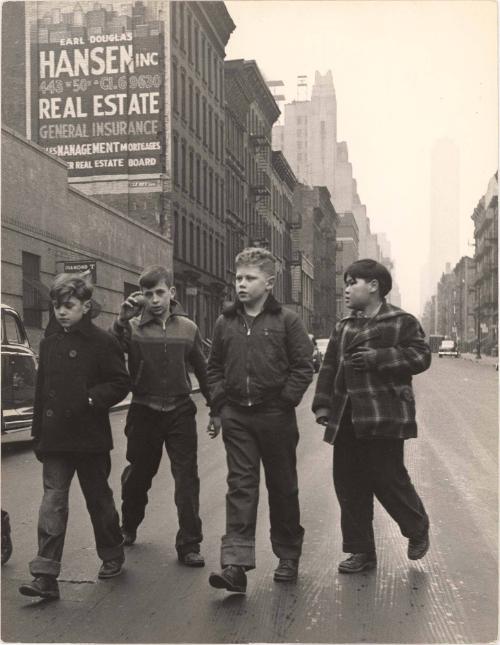 NYC boy walking down street with friends