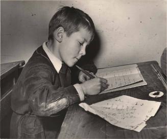 Boy doing his school composition, Paris