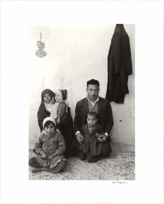 Family portrait in Teheran, in a cold, one room house, Iran