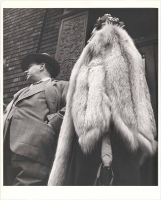 Man in Suit, Woman in Fur Coat