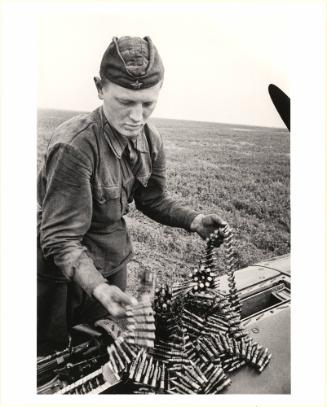 Gunner Loading Ammunition