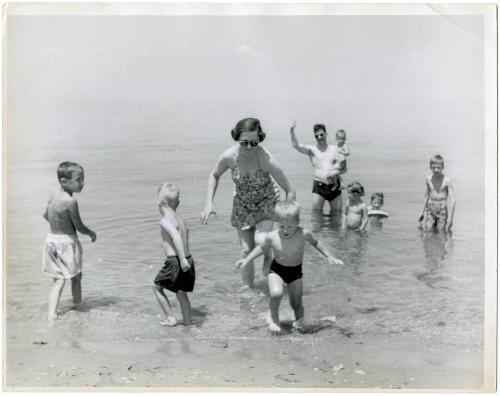 Mother and father with children at the beach