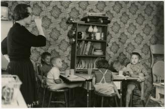 Mother with children at table